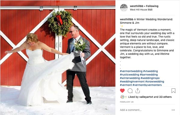 Bride and Groom stand in front of red barn in Instagram Post from West Hill House Bed and Breakfast.