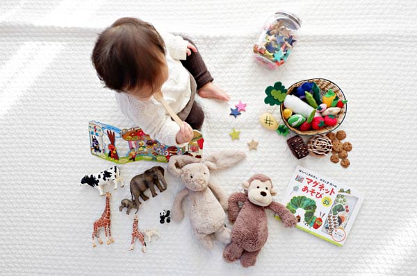 baby plays with toys